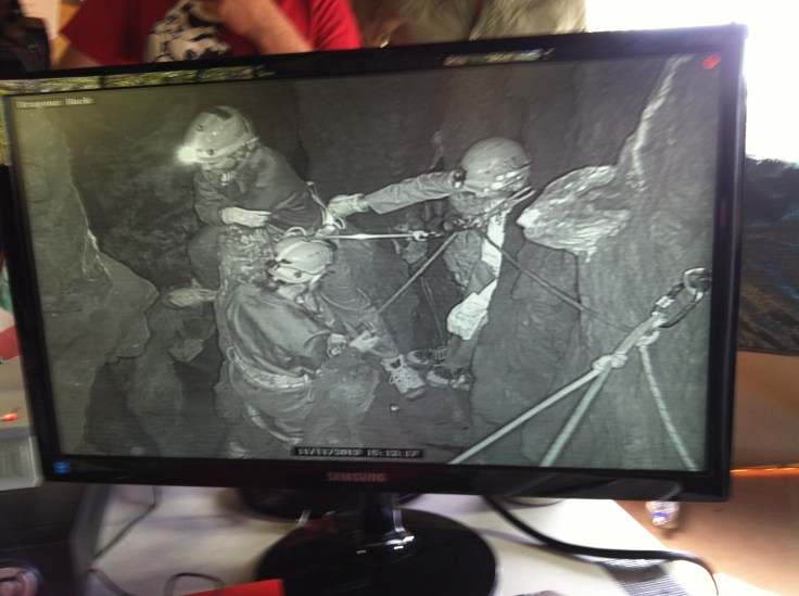(Caption from National Geographic, click on image to get the story and original image) From the Command Center tent, Lee Berger can monitor the progress of the team past obstacles and while collecting or excavating fossils through remote cameras installed by members of the regional caving club. (Photo by Andrew Howley)
