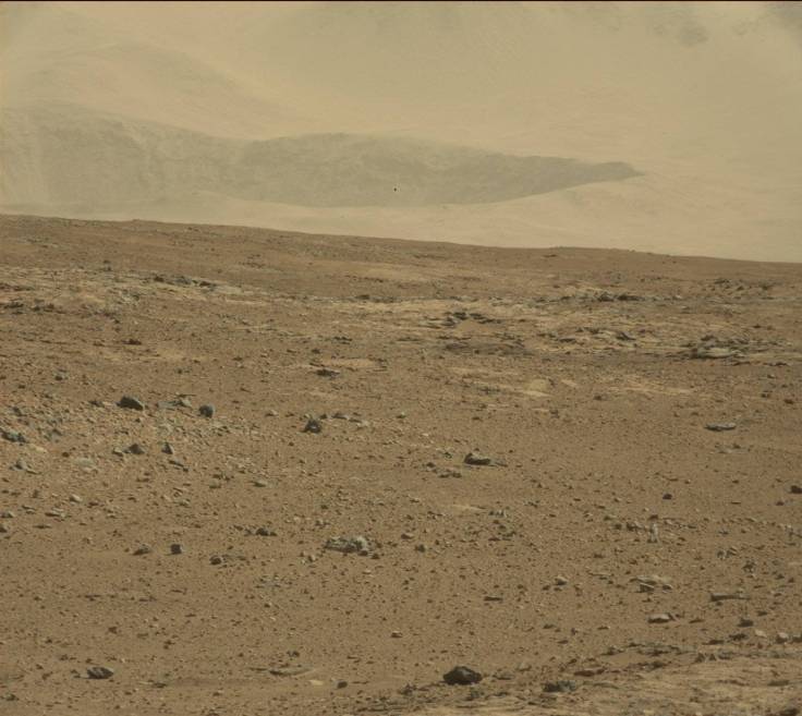 An ancient crater at the base of the Gale crater walls is visible in the distance.  Image: JPL/NASA/MSSS