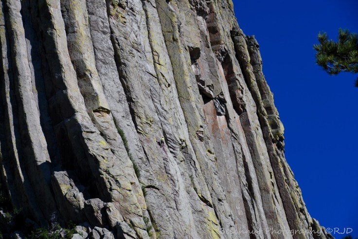 Can you see the rock climbers in the image? Photo: Joel Duff