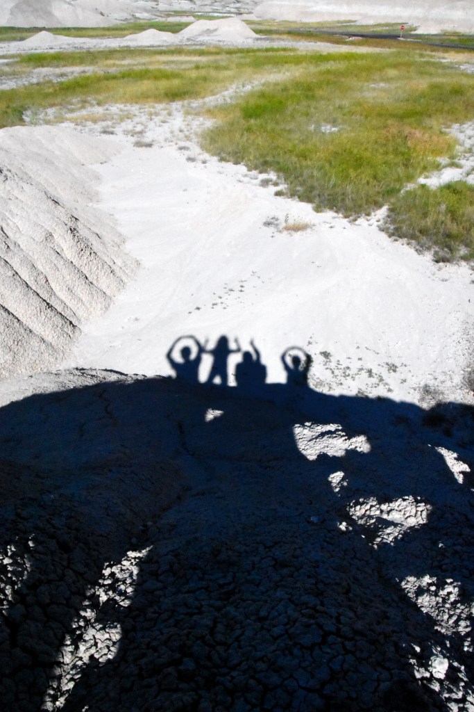 We bring a bit of Ohio to the Badlands. That's me as the "I" with one hand up and the other hand holding the camera to take this picture. 