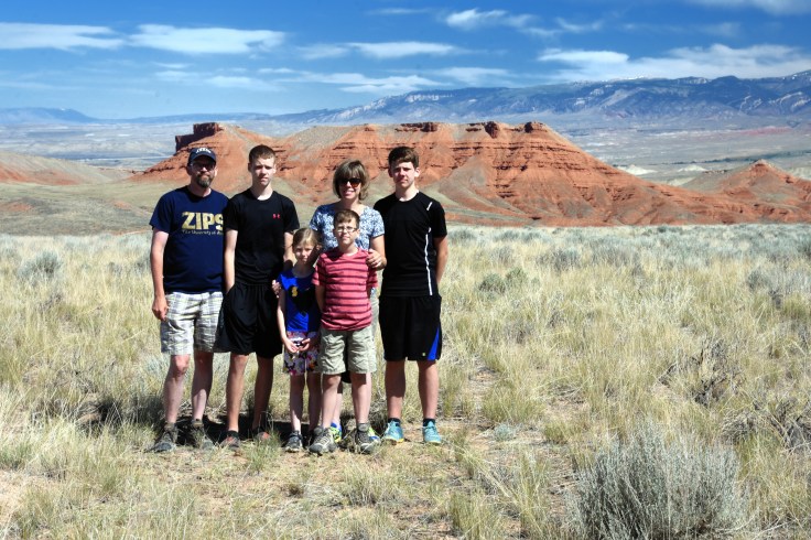 My family (minus my oldest daughter) in the Bighorn basin with the Bighorn Mountains in the background. We are a few miles from the Red Gulch dinosaur tracks that we visited. Photo: Joel Duff, June 2016
