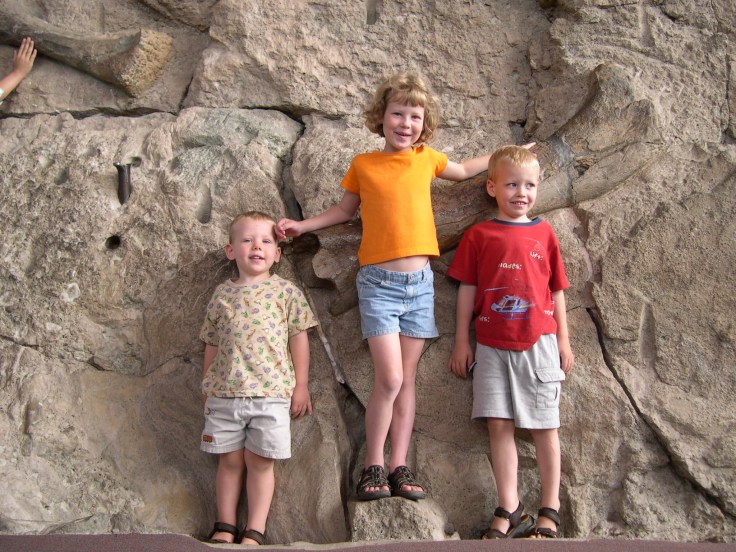 Some of my kids posing in front of dinosaur bones exposed at Dinosaur National Monument more than 10 years ago. 
